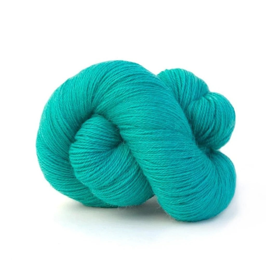 blue skein of yarn on white background