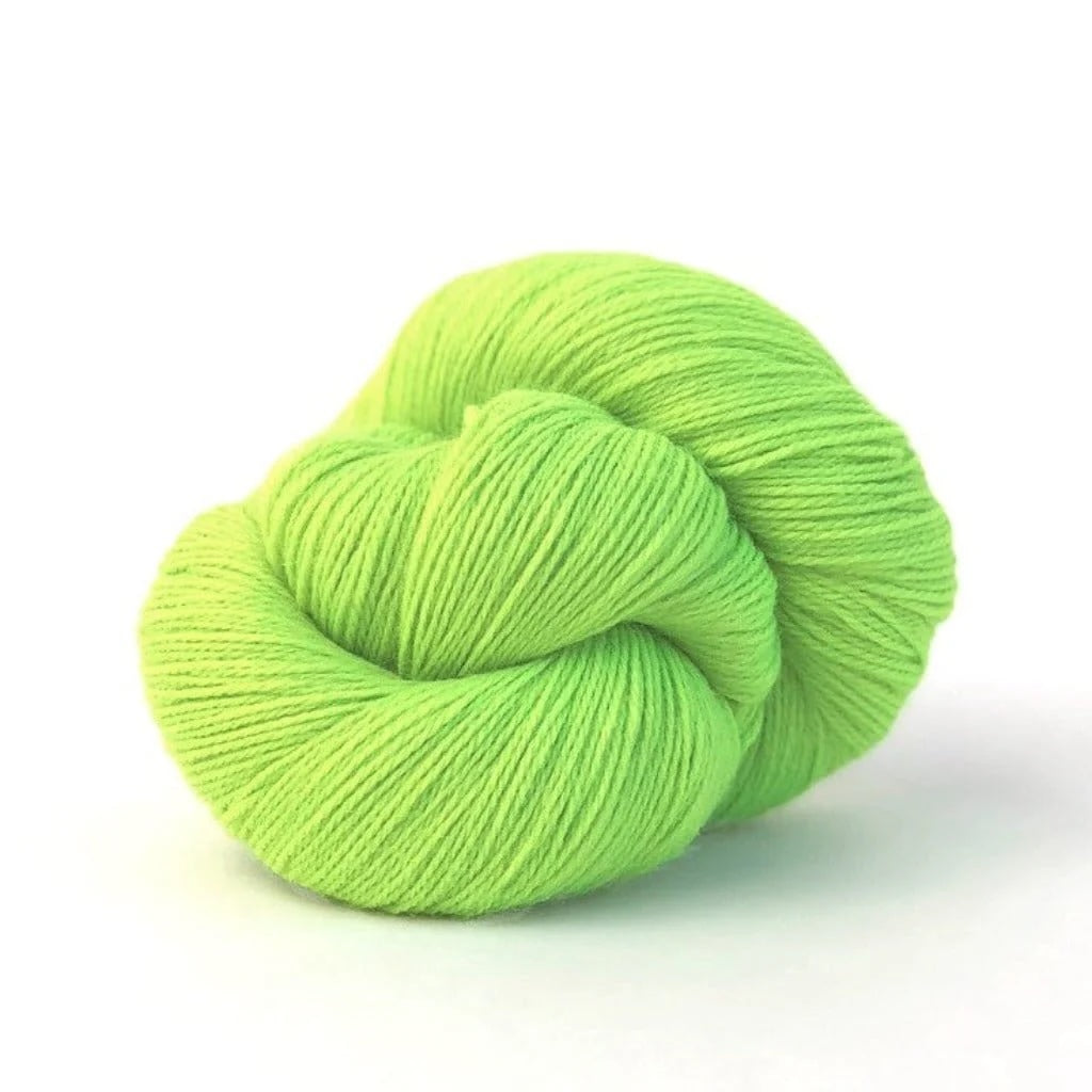 neon green skein of yarn on white background