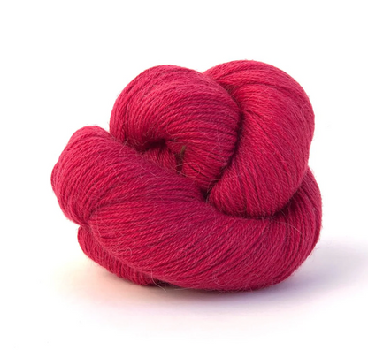 red skein of yarn on white background
