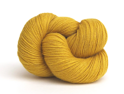 gold skein of yarn on white background